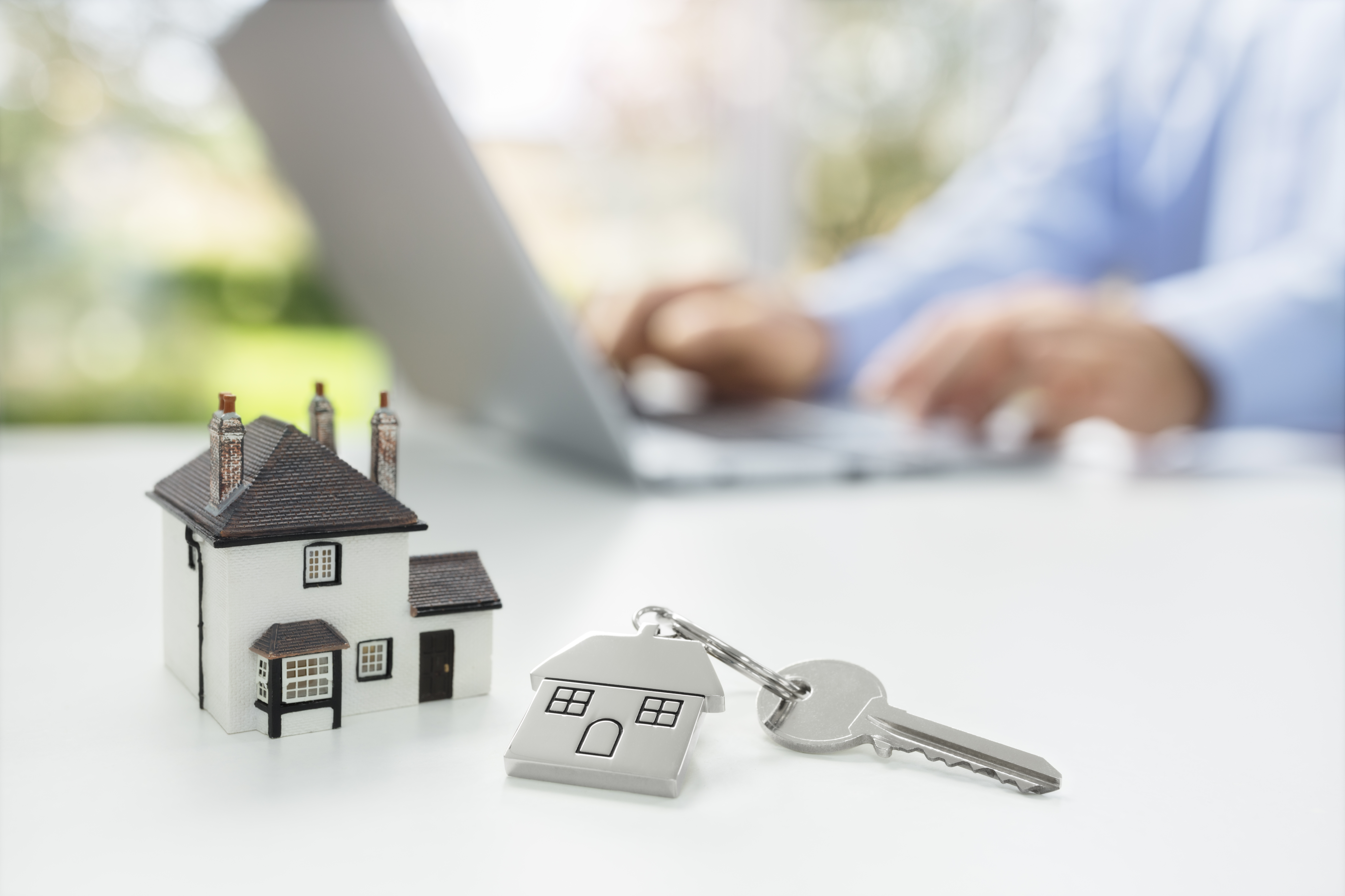 Searching the internet for real estate or new house Searching the internet for real estate or new house with model home and key